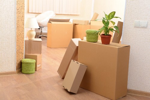 Furniture and boxes being loaded into a moving van in Dartford